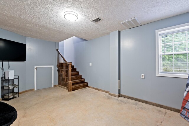 1056 Simms Heights Rd, Kingston Springs, TN 37082 - below grade area featuring stairs, baseboards, and a textured ceiling