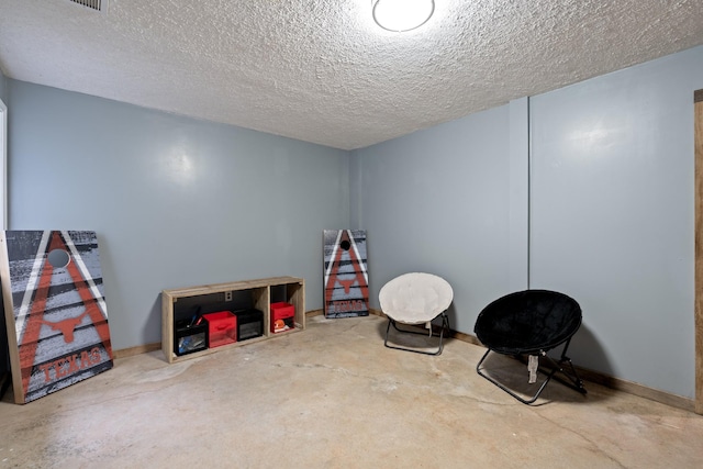 1056 Simms Heights Rd, Kingston Springs, TN 37082 - recreation room with concrete floors, a textured ceiling, and baseboards