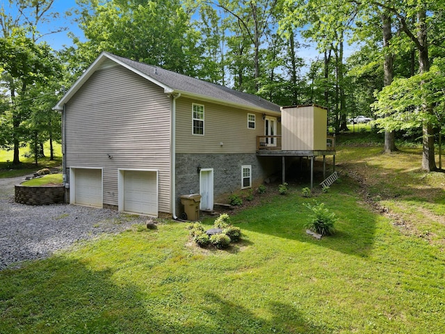 1056 Simms Heights Rd, Kingston Springs, TN 37082 - back of property featuring a garage, gravel driveway, a yard, and a deck
