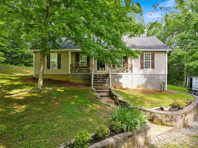 1056 Simms Heights Rd, Kingston Springs, TN 37082 - view of front of home featuring covered porch, a front yard, and a shingled roof
