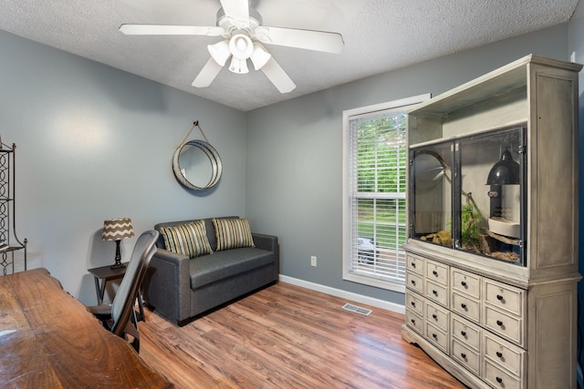 1056 Simms Heights Rd, Kingston Springs, TN 37082 - office area with wood finished floors, a ceiling fan, a textured ceiling, and baseboards