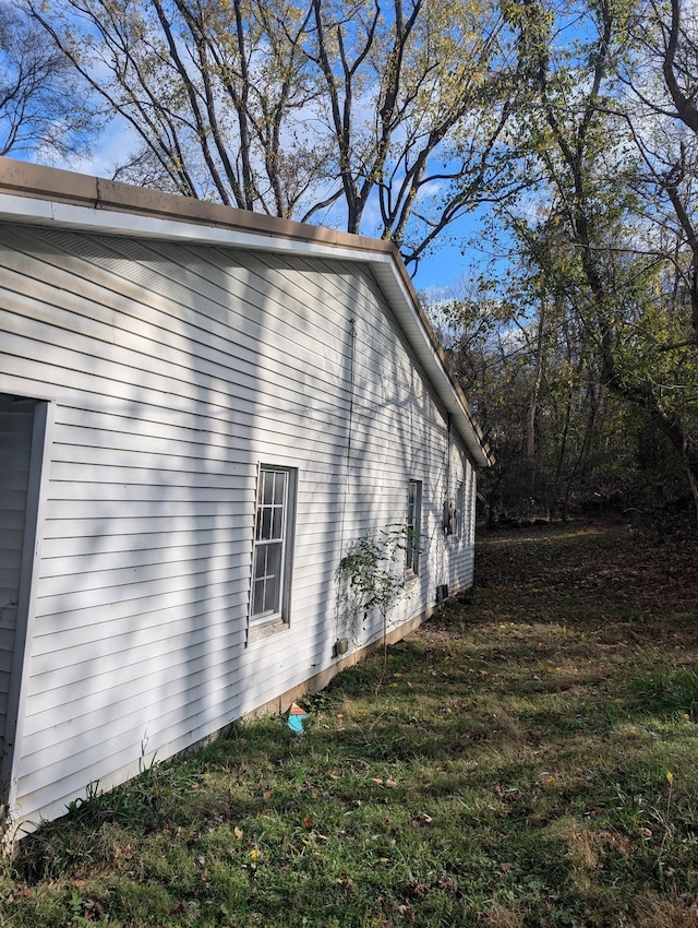 view of home's exterior with a lawn