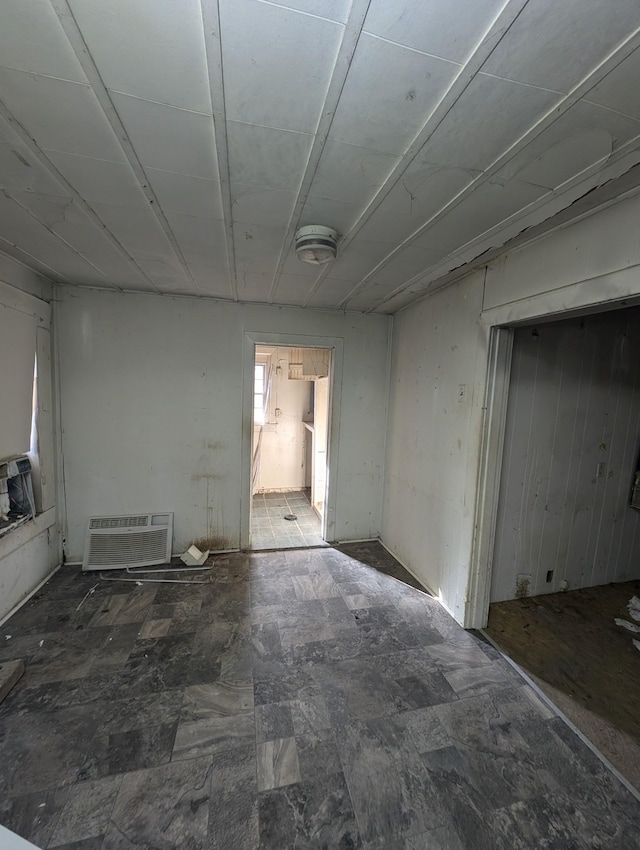 empty room featuring a wall mounted air conditioner