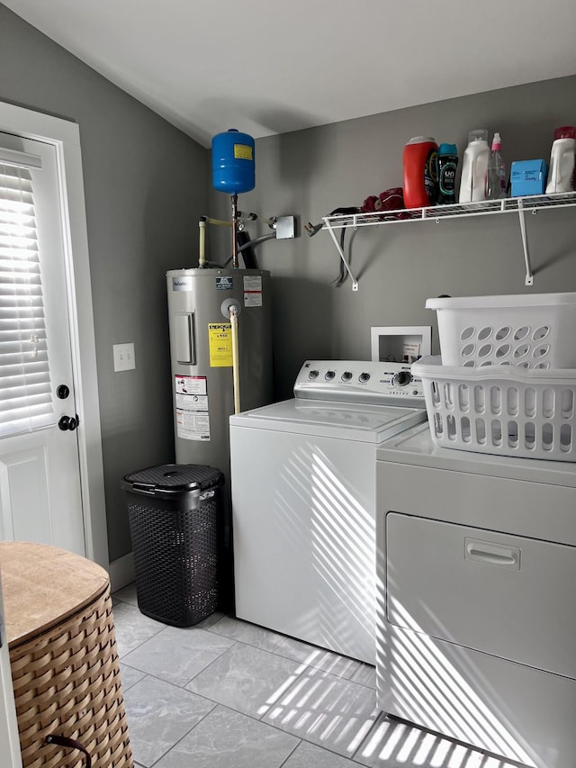 219 Garner St, Springfield, TN 37172 - washroom with electric water heater and washing machine and dryer