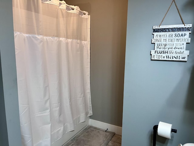 219 Garner St, Springfield, TN 37172 - full bathroom featuring tile patterned flooring, a shower with shower curtain, and baseboards