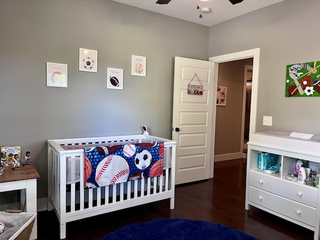 219 Garner St, Springfield, TN 37172 - bedroom featuring wood finished floors, a crib, baseboards, and a ceiling fan