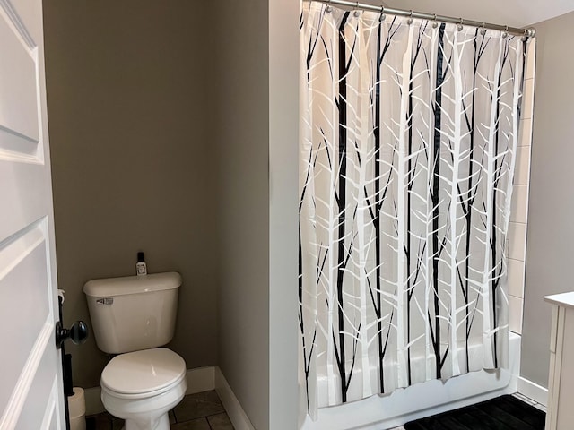 219 Garner St, Springfield, TN 37172 - bathroom with toilet, shower / bathtub combination with curtain, baseboards, and tile patterned floors