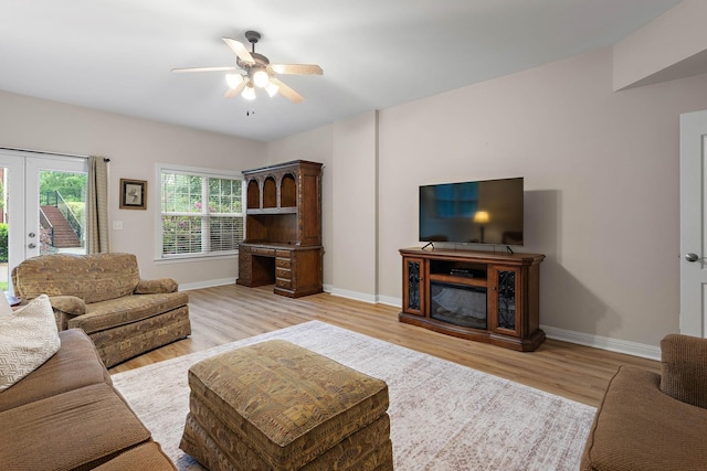 313 Red Feather Ln, Brentwood, TN 37027 - living room with light wood-style floors, a ceiling fan, and baseboards