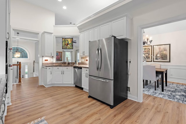 313 Red Feather Ln, Brentwood, TN 37027 - kitchen with appliances with stainless steel finishes, light wood-style flooring, white cabinetry, a chandelier, and recessed lighting