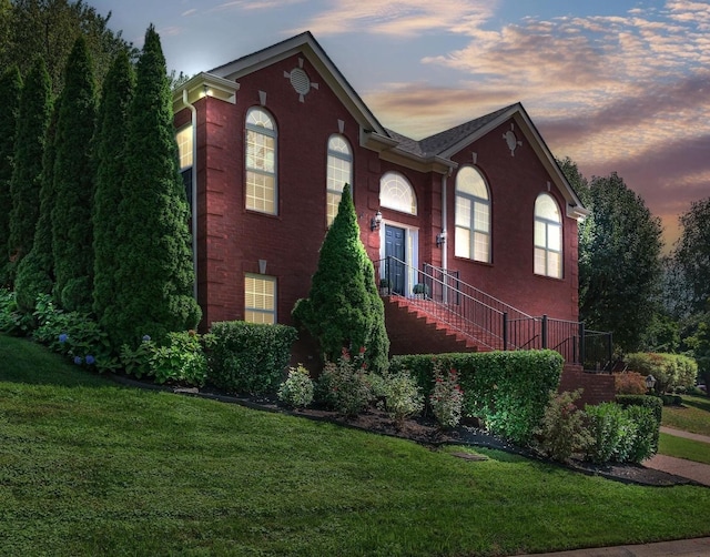 313 Red Feather Ln, Brentwood, TN 37027 - property exterior at dusk with a lawn and stairway