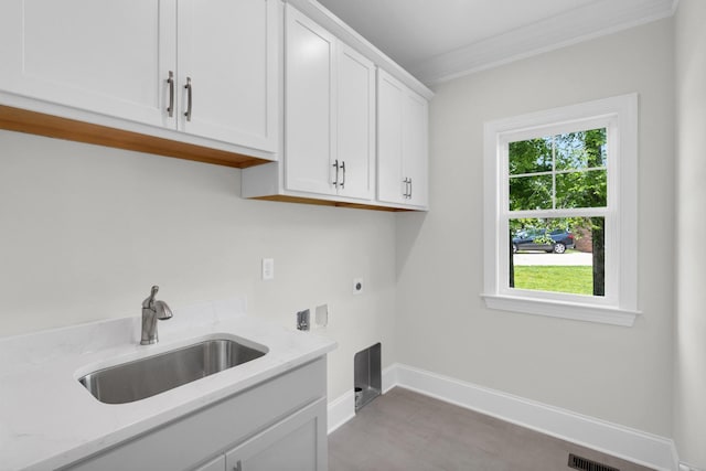 2212 Peterson Dr, Chattanooga, TN 37421 - laundry room with electric dryer hookup, cabinet space, and crown molding