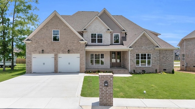 2212 Peterson Dr, Chattanooga, TN 37421 - craftsman house featuring driveway, a garage, a front yard, and brick siding