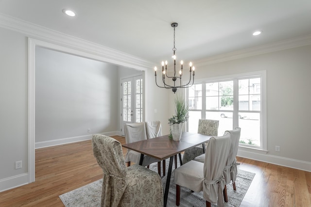 2212 Peterson Dr, Chattanooga, TN 37421 - dining area featuring a chandelier, ornamental molding, and light wood finished floors