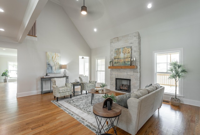 2212 Peterson Dr, Chattanooga, TN 37421 - living room featuring a ceiling fan, a fireplace, wood finished floors, recessed lighting, and high vaulted ceiling