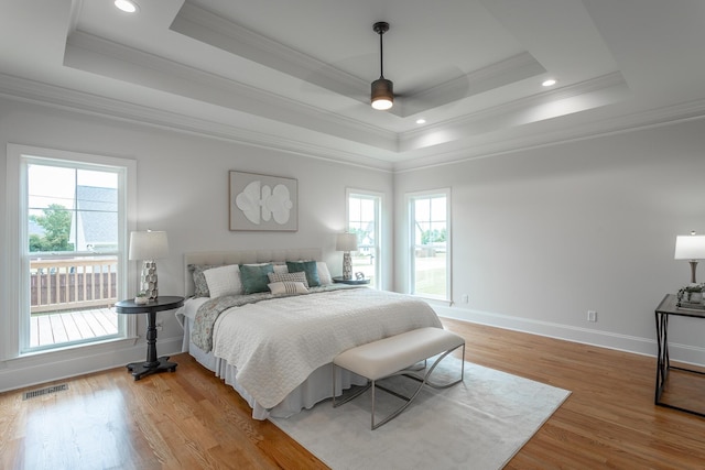 2212 Peterson Dr, Chattanooga, TN 37421 - bedroom featuring crown molding, a raised ceiling, light wood-type flooring, recessed lighting, and a ceiling fan