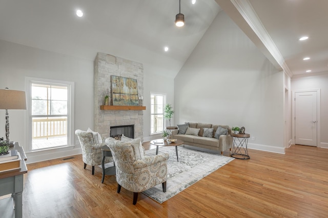 2212 Peterson Dr, Chattanooga, TN 37421 - living room with a ceiling fan, light wood-type flooring, plenty of natural light, a stone fireplace, and recessed lighting