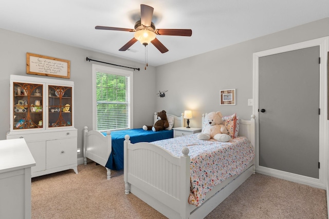 1951 Winsome Ln, Adams, TN 37010 - bedroom featuring light carpet, ceiling fan, and baseboards