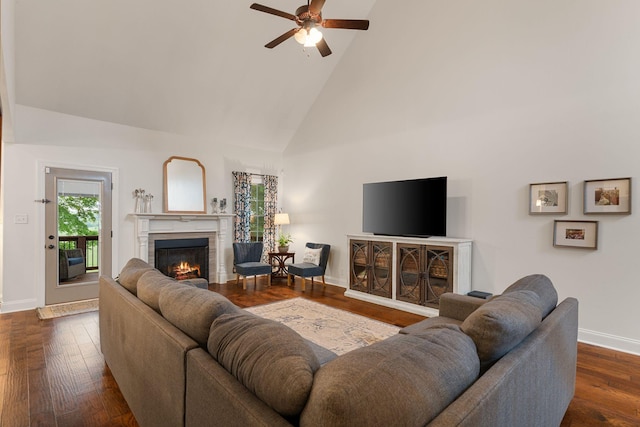 1951 Winsome Ln, Adams, TN 37010 - living area with a lit fireplace, high vaulted ceiling, baseboards, ceiling fan, and dark wood-style floors