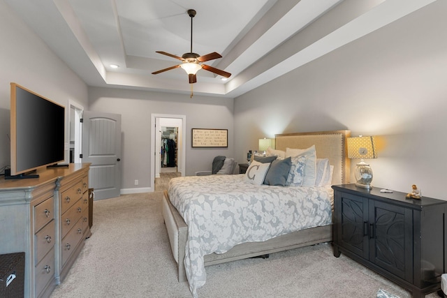 1951 Winsome Ln, Adams, TN 37010 - bedroom featuring light colored carpet, a raised ceiling, a walk in closet, baseboards, and a ceiling fan