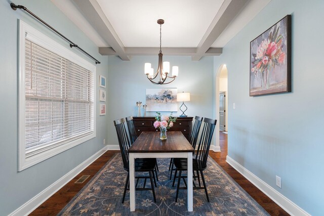 1951 Winsome Ln, Adams, TN 37010 - dining area featuring arched walkways, wood finished floors, beam ceiling, a chandelier, and baseboards
