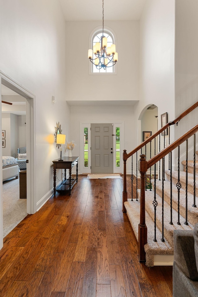 1951 Winsome Ln, Adams, TN 37010 - foyer featuring hardwood / wood-style floors, plenty of natural light, a high ceiling, a chandelier, and arched walkways