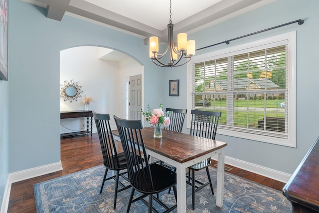 1951 Winsome Ln, Adams, TN 37010 - dining area featuring arched walkways, a chandelier, baseboards, and wood finished floors