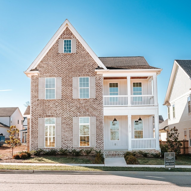 2013 Hector Dr, Thompsons Station, TN 37179 - view of front of house featuring a balcony, brick siding, board and batten siding, and a porch