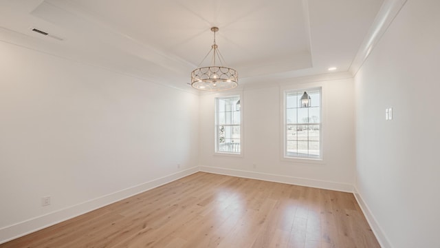 2013 Hector Dr, Thompsons Station, TN 37179 - unfurnished dining area with a raised ceiling, light wood-style floors, a chandelier, baseboards, and ornamental molding