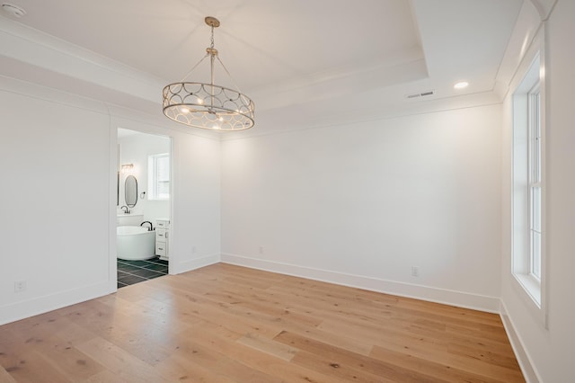 2013 Hector Dr, Thompsons Station, TN 37179 - unfurnished dining area featuring a chandelier, light wood-style flooring, baseboards, ornamental molding, and plenty of natural light