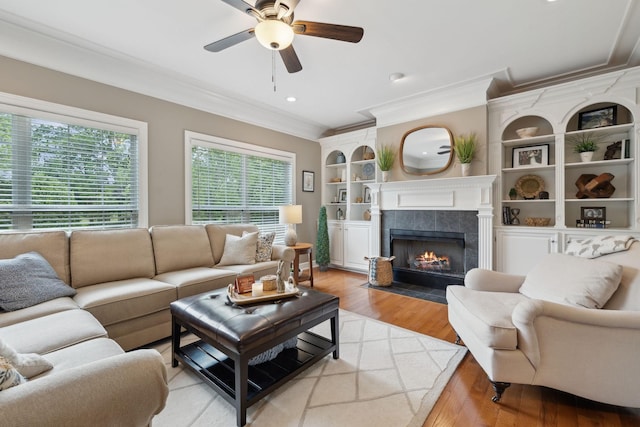 2335 Garrison Cv, Murfreesboro, TN 37130 - living area featuring ornamental molding, ceiling fan, a tile fireplace, light wood-style flooring, and recessed lighting
