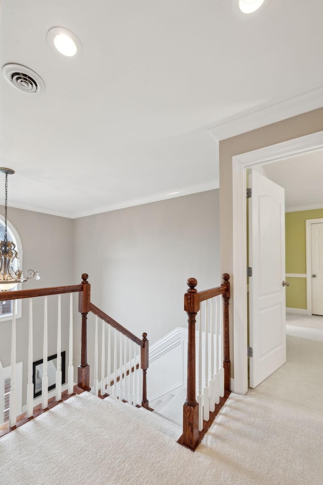 2335 Garrison Cv, Murfreesboro, TN 37130 - staircase featuring carpet flooring, crown molding, and a chandelier