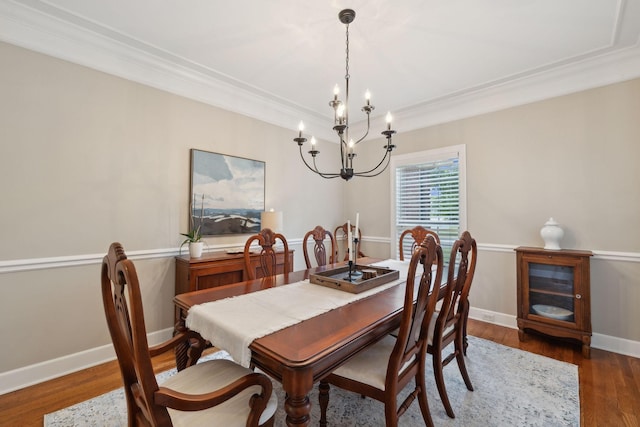 2335 Garrison Cv, Murfreesboro, TN 37130 - dining room featuring a chandelier, crown molding, wood finished floors, and baseboards