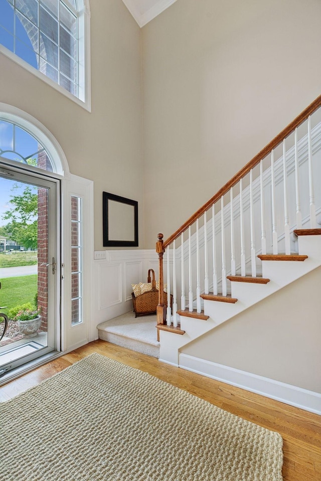 2335 Garrison Cv, Murfreesboro, TN 37130 - foyer entrance featuring a towering ceiling, wood finished floors, stairs, and ornamental molding
