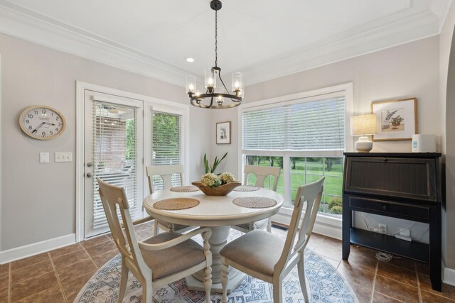 2335 Garrison Cv, Murfreesboro, TN 37130 - dining room featuring ornamental molding, a chandelier, baseboards, and dark tile patterned floors