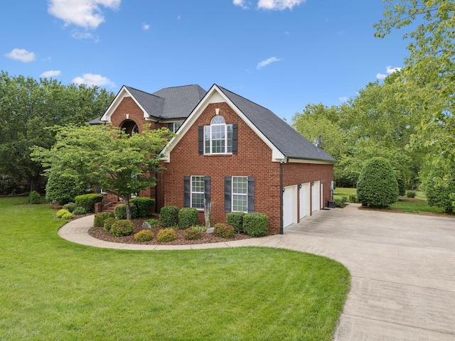 2335 Garrison Cv, Murfreesboro, TN 37130 - view of front of property with brick siding, concrete driveway, and a front lawn