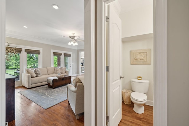 2335 Garrison Cv, Murfreesboro, TN 37130 - bathroom featuring ornamental molding, a ceiling fan, wood finished floors, toilet, and baseboards