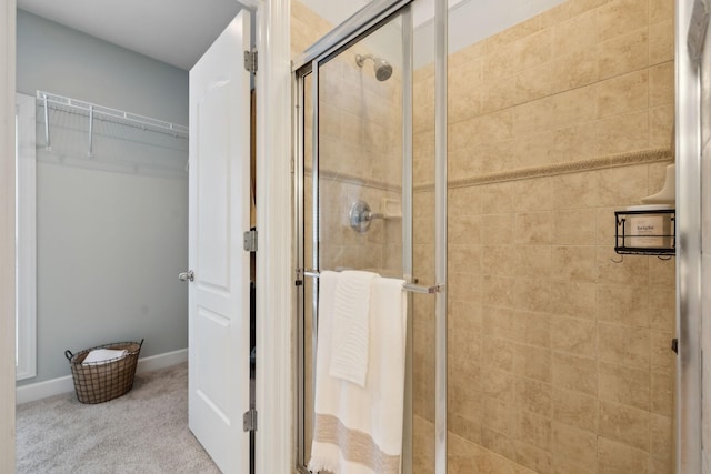 2335 Garrison Cv, Murfreesboro, TN 37130 - full bathroom featuring a shower stall, baseboards, and a spacious closet