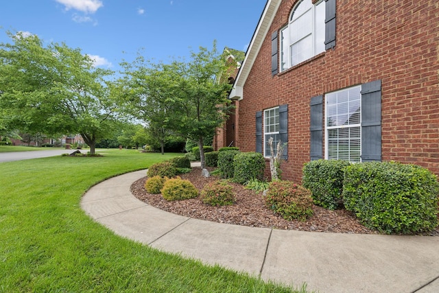 2335 Garrison Cv, Murfreesboro, TN 37130 - view of side of home with a lawn and brick siding