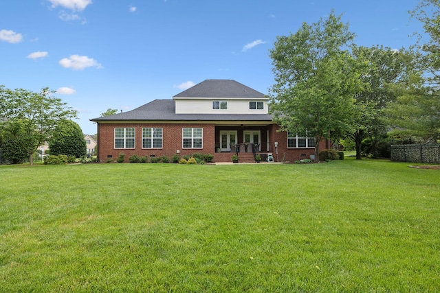 2335 Garrison Cv, Murfreesboro, TN 37130 - rear view of house featuring a yard and brick siding