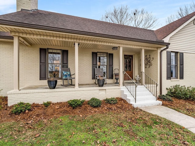 473 S Fishing Ford Rd, Petersburg, TN 37144 - view of front of property with covered porch, a shingled roof, brick siding, and a chimney
