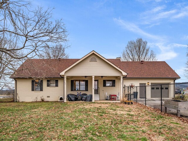 473 S Fishing Ford Rd, Petersburg, TN 37144 - rear view of house with brick siding, an attached garage, roof with shingles, and concrete driveway