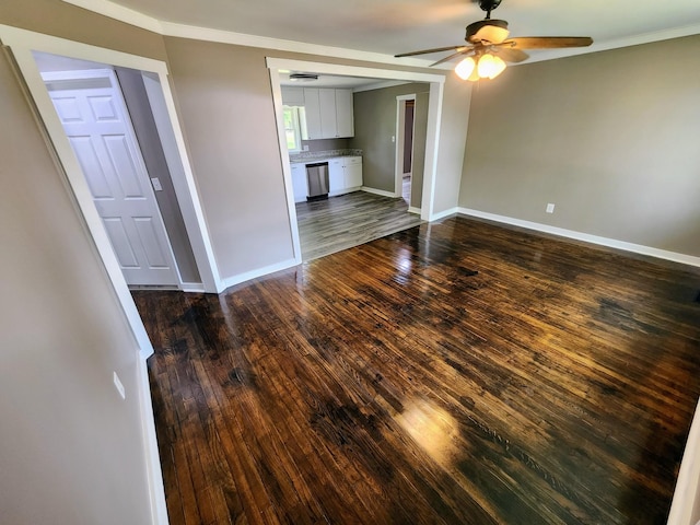 306 Johnson St, Lawrenceburg, TN 38464 - unfurnished living room with ceiling fan, baseboards, dark wood finished floors, and crown molding