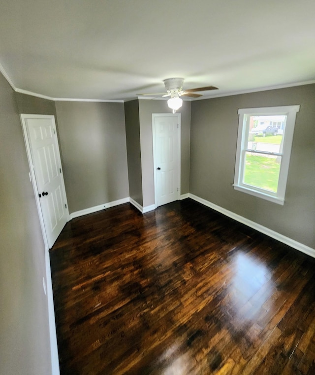 306 Johnson St, Lawrenceburg, TN 38464 - unfurnished room with ornamental molding, dark wood-style flooring, baseboards, and ceiling fan