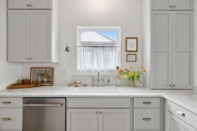 bar featuring stainless steel dishwasher and a sink
