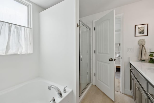 full bathroom featuring connected bathroom, a stall shower, vanity, and a bath
