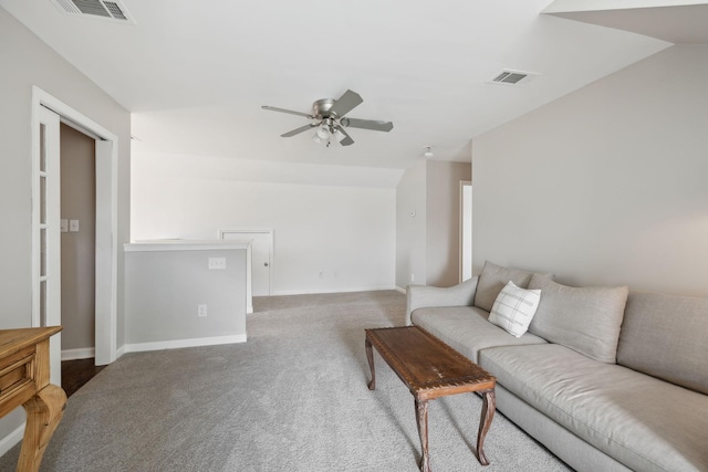 living area with carpet floors, a ceiling fan, and baseboards