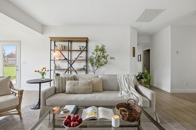 living room with wood finished floors and baseboards