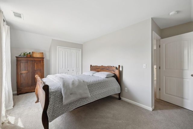 bedroom with light carpet, a closet, and baseboards