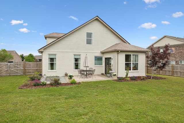 rear view of property featuring a patio area