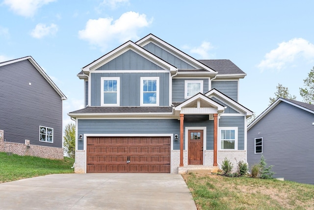 craftsman house featuring board and batten siding, concrete driveway, an attached garage, a front yard, and brick siding